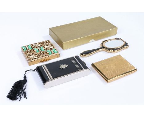 Art Deco camera style vanity case in black enamel with cigarette holder, money clip and lipstick holder decorated with marcas