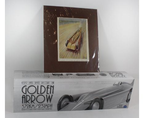 A boxed 1929 Land Speed Record car 'Golden Arrow'372KM-231 MPH from The Schylling Collector series and a coloured print by Ro