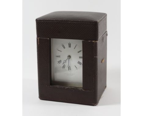 A French brass carriage clock Of typical form, the white enamel dial with Roman numerals and bearing retailers mark for G Bon