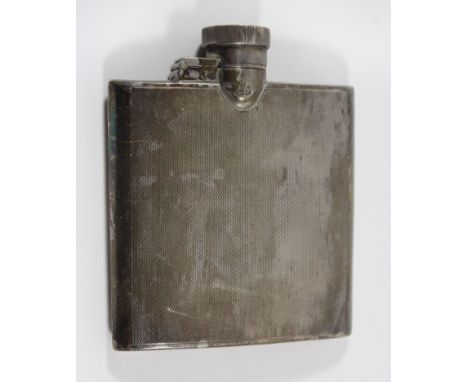 A 1930s silver hip flask Of rectangular form with engine turned decoration and personal inscription to hinged lid, Birmingham