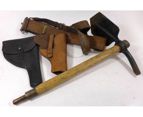 A collection of British military equipmentLeather Sam Browne belt, black leather pistol holster, brown leather pistol holster