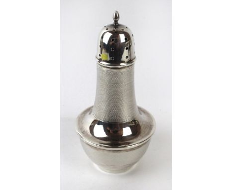 A 1930s silver shakerOf baluster form, the engine turned shaker with pierced and cap, Birmingham, 1934, height 17cm, weight a