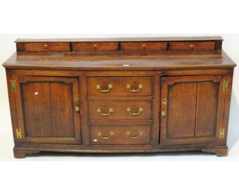 An 18th Century oak dresser baseThe small top section with three frieze drawers and a single plate shelf, over a base with th