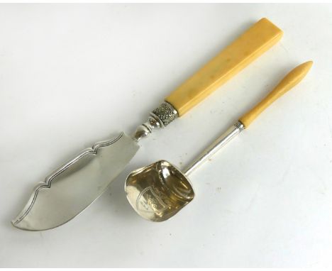 A Georgian silver caddy spoon and butter knifeEach designed as a plain bowl and blade with engraved decoration and ivory hand