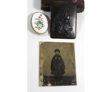 A Georgian pressed tortoiseshell portrait plaqueA further cased portrait photograph on glass and a small Bilston enamel type 