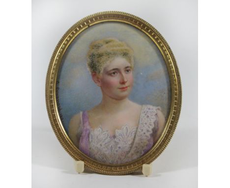A 19th Century miniature portrait of a young ladyWatercolour and gouache, unsigned, set in a oval metal frame, height 10cm  A