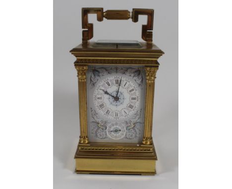 A fine quality carriage clock with floral decorated faceWith Roman and Arabic numerals, small subsidiary dial, surrounded by 