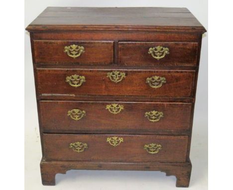 A George III oak chest of two short and three long drawersWith brass handles, raised on bracket feet, height 100cm, width 90c