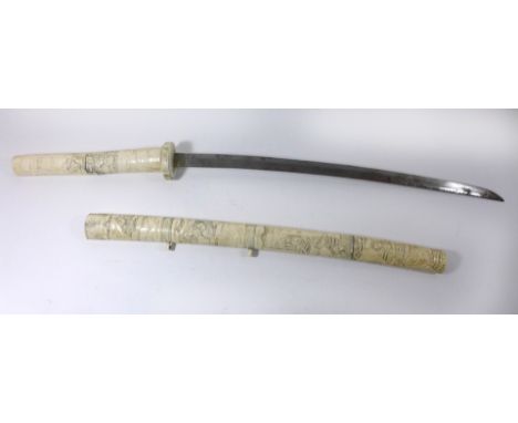 A Japanese ivory mounted Wakizashi sword, late 19th/early 20th Century51cm curved single edged blade, the tsuba, grip and sca