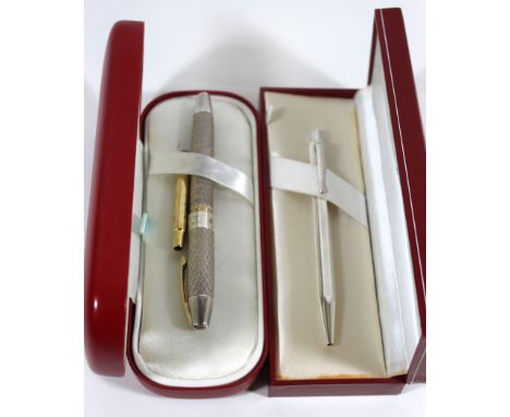 A Sheaffer sterling silver fountain penWith engine turned outer case and 18ct gold nib, fitted in original box, together with