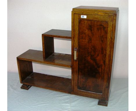 Art Deco, a small oak 1930's book shelf with its original handle and feet measuring 28 tall.   CONDITION REPORT:  In good con