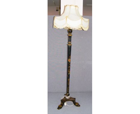 An early 20th century standard lamp hand painted in the chinoiserie style on tripod feet with an ornate shade.   CONDITION RE