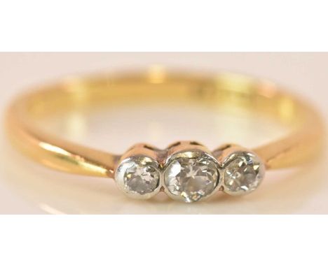 An 18ct yellow gold three stone graduated diamond ring, size K 1/2, approx 2.1g.