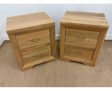 OAK FURNITURE LAND; two light oak bedside tables with two drawers and chrome handles, 82 x 50 x 40cm (2).
