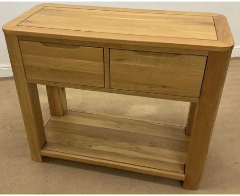 OAK FURNITURE LAND; a light oak console table with two large drawers over void, 80 x 98 x 44cm, has assembly instructions.