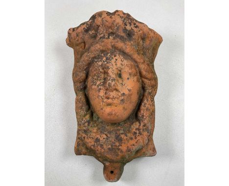 A terracotta wall mounted planter in the form of a woman's face, 45 x 32 x 20cm.