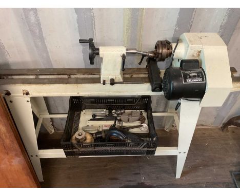 AXMINSTER; a wood turning lathe, together with tools and equipment for turning wood.