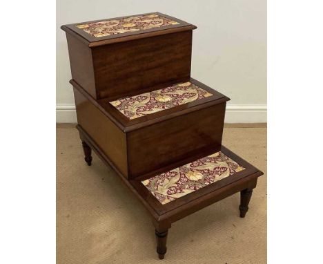A 19th century mahogany step commode, raised on turned tapering legs to peg feet.