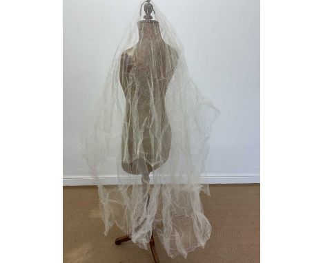 A vintage wedding veil purchased from Harrods and in original box.