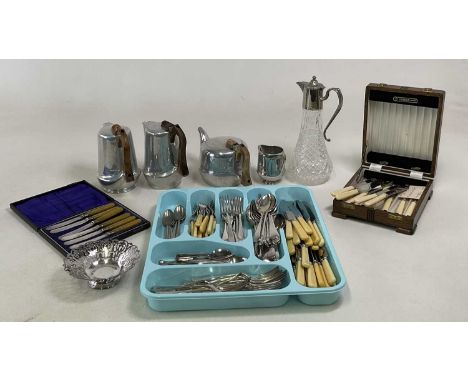 A four piece Picquot ware tea service, together with a claret jug and a quantity of flatware.