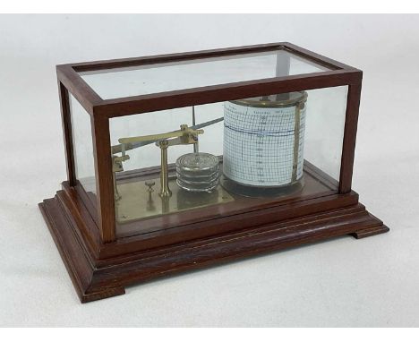 An oak cased barograph raised on spreading bracket supports, width 35.5cm.