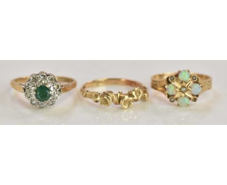 A 9ct yellow gold emerald set dress ring, size O1/2, a 9ct yellow gold flower decorated ring, size N 1/2, combined approx 4.8
