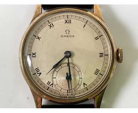 OMEGA; a gentleman's vintage 9ct gold cased wristwatch, with Roman numerals and subsidiary seconds hand to the circular dial 