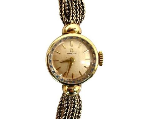 OMEGA; a lady's vintage 9ct yellow gold wristwatch, with baton markers to the circular dial, multistrand bracelet and gold de