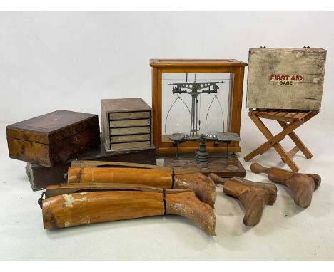 A group of collectors' items comprising a set of brass postal scales, a set of scientific balance scales, wooden first aid ca