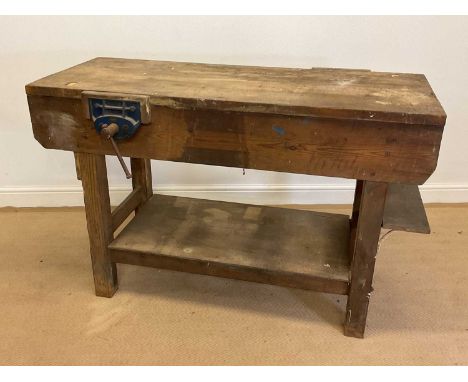 A wooden work bench with two vices mounted on either side, height 86cm, width 134cm, depth 54cm.Condition Report: a solid wor