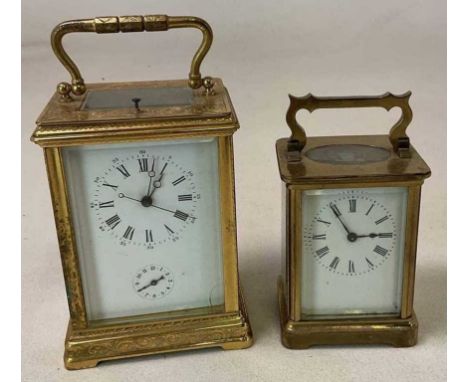 A large late 19th century brass carriage clock striking on a bell, height 14cm and a further carriage clock.Condition Report: