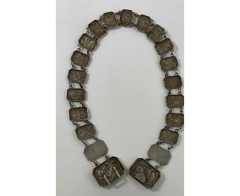 WANG HING; a Chinese silver belt made of rectangular plaques with canted corners, the twin main plaques decorated with dragon