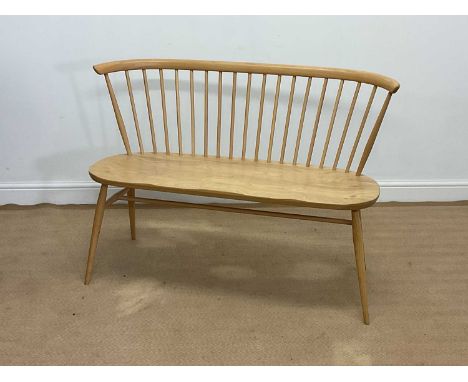 ERCOL; an oak Heritage Loveseat, height 84cm, width 111cm, depth 44cm.Condition Report: A few minor dents to along the front 