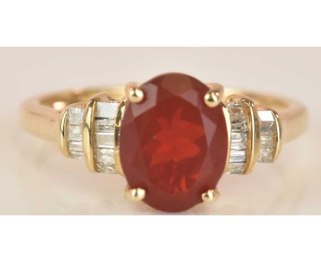 A 9ct yellow gold fire opal and diamond set ring of stepped design, size N, approx 2.4g.