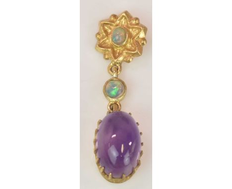 A yellow metal amethyst and opal pendant, the two circular opal cabochons totalling approx 0.30ct, with an oval amethyst cabo