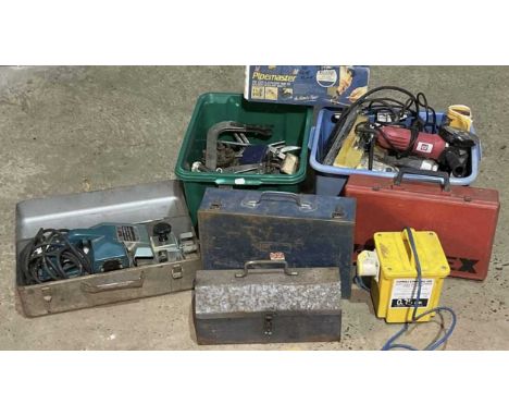 A quantity of electric tools to include a nail gun, Wolf sander, drill, a transformer box, and other items of equipment.