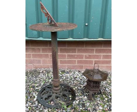 A cast iron sundial, height 90cm, and pagoda style lantern, (2).