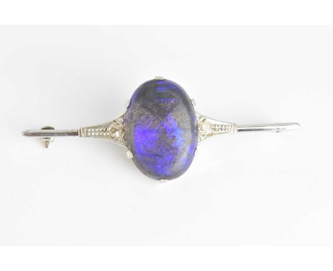 An 18ct white gold platinum tipped boulder opal and diamond bar brooch, length 57mm, approx 7g.