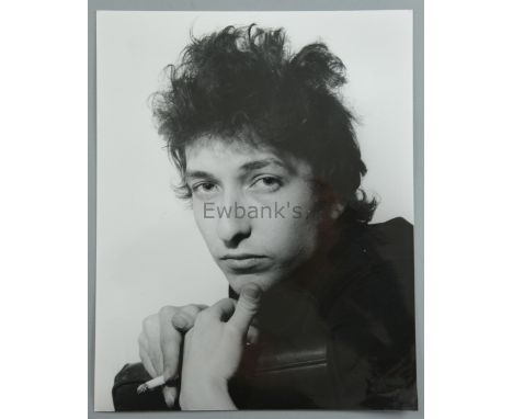 Bob Dylan, early black & white photograph of the singer, by Harry Goodwin, stamped on reverse, 25 x 20 cm. Provenance: Collec