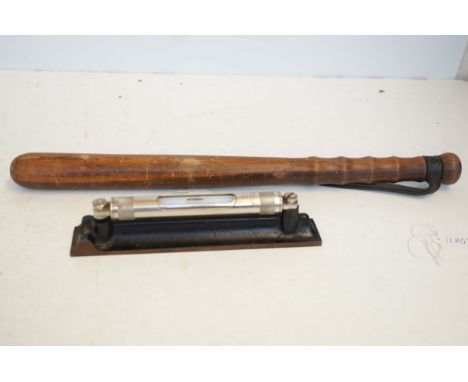 Vintage truncheon together with Rabone chesterman spirit level