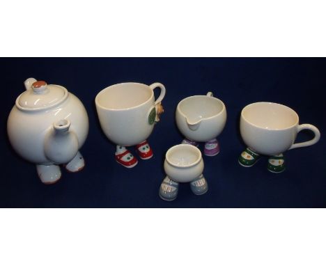 Selection of Carlton Ware Walking Ware comprising two cups, egg cup, cream jug and another similar tea pot