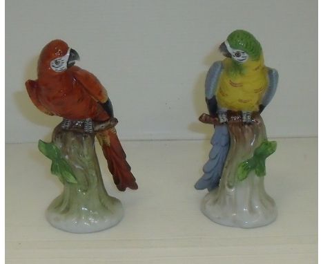Pair of Sitzendorf parrot figurines on tree trunk bases (one a/f) (13.5cm high)