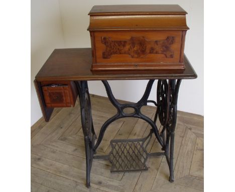 Vintage sewing machine table with machine and top cover with treadle base