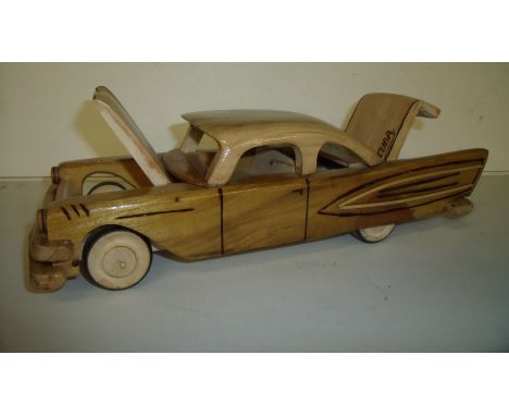 Carved wooden model of Chrysler Cuba 1957 with lift up trunk and hood