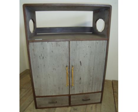 Small Japanese bedside cabinet with open shelf above two central drawers revealing shelf and two further cupboards and two lo