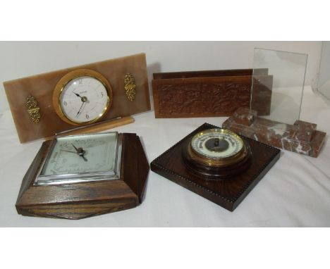 Two oak framed barometers, 1950's alabaster and glass photograph frame, marble effect mantel clock and carved wooden letter /