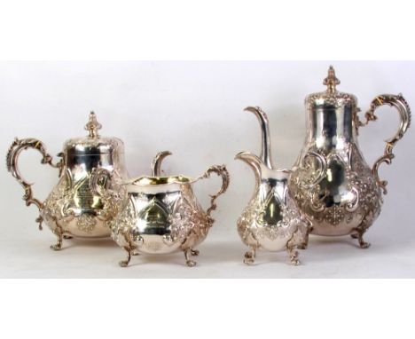 VICTORIAN SILVER TEA AND COFFEE SERVICE OF FOUR PIECES, pear shaped, with baroque chased and repousse decoration of 'C' scrol