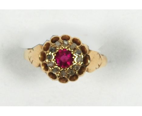 18 CT GOLD, RUBY AND DIAMOND CLUSTER RING, set with a circular centre ruby and surround of twelve tiny rose cut diamonds 3.5 