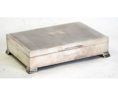 ENGINE TURNED SILVER CLAD TABLE CIGARETTE BOX, by Edward Viners, with slightly domed cover, stepped bracket feet and hardwood