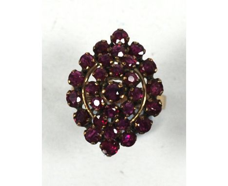 GOLD AND GARNET MARQUISE RING, with three tier cluster of twenty nine small garnets, 4.5gms, marked 18k, ring size M/N